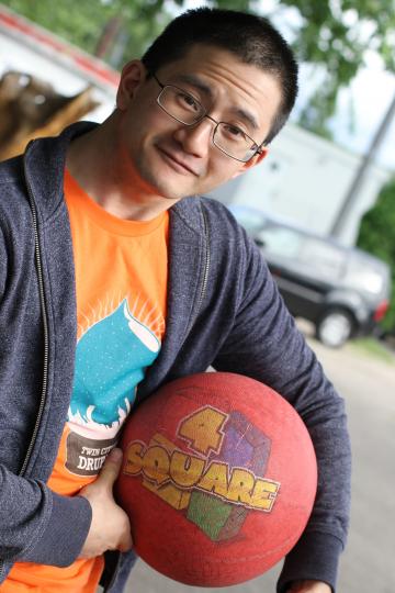 A man holding a 4 square ball